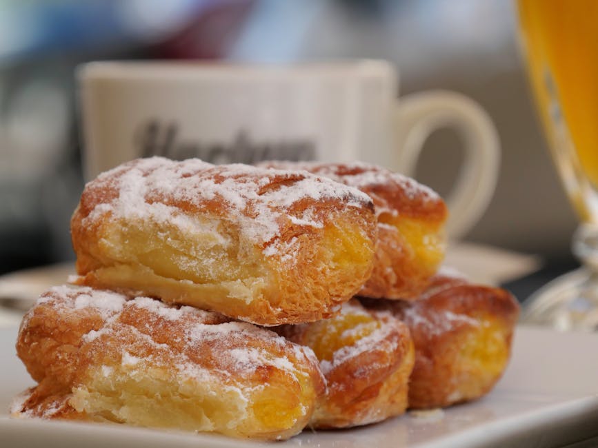 Oransjeduftende beignets med mandelsukker