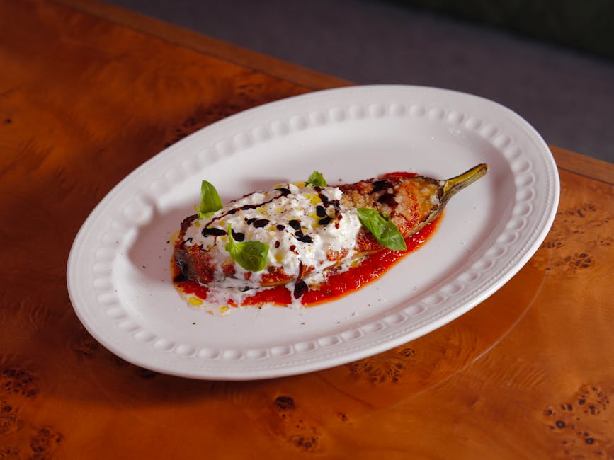 Bakt aubergine med kulturmelksaus og granateple